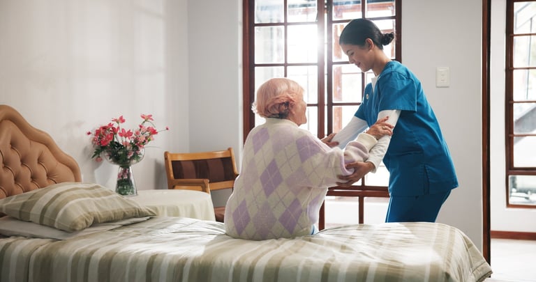 Caregiver helping senior with daily activities